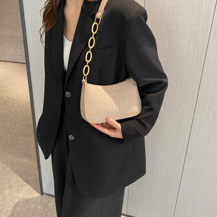 Magnella | Elegant axelväska i krokodilmönstrad design